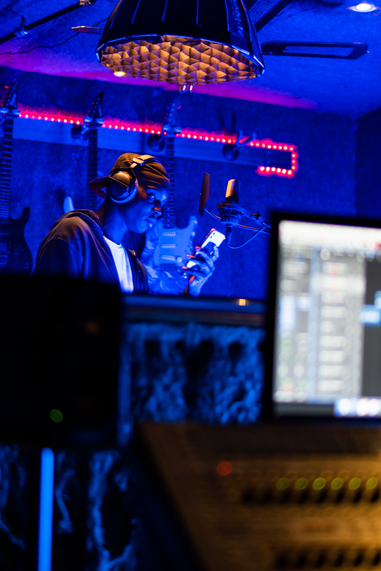 Recording session lit in blue and red for a music video shoot