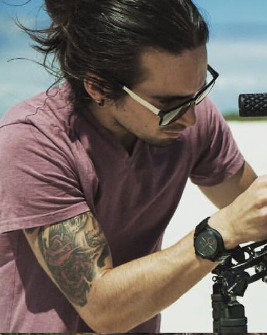 Tim McCartney checking a RED cinema camera on location